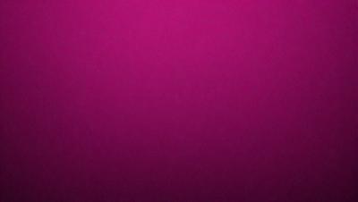 The primary subject of the image is a large, pink surface. The setting is a close-up of the pink surface, which appears to be a wall or a piece of fabric. The visual style is a close-up, which emphasizes the pink color and texture of the surface. The colors and mood of the image are predominantly pink, creating a warm and inviting atmosphere.