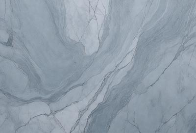 The primary subject of the image is a marble-like surface with a pattern of swirls and grooves. The setting is a bathroom, with the marble-like surface serving as the backdrop. The visual style is a close-up of the marble-like surface, showcasing its intricate pattern. The colors and mood of the image are predominantly grays and blues, giving it a sophisticated and elegant appearance.
