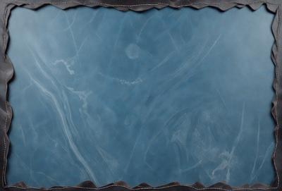 The primary subject of the image is a blue marble background. The setting is a dark room, and the visual style is a close-up of the marble. The colors and mood are predominantly dark and moody, with the blue marble being the main focus of the image.