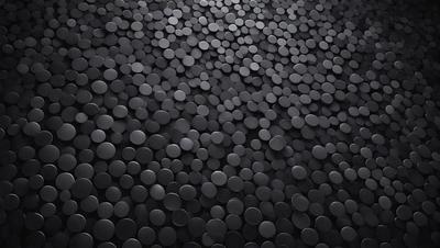The primary subject of the image is a close-up of a black and white patterned surface, which appears to be a tile or a black and white checkered floor. The setting is a dark room, and the visual style is a black and white photo. The dominant colors are black and white, and the overall atmosphere is somewhat moody and dramatic.