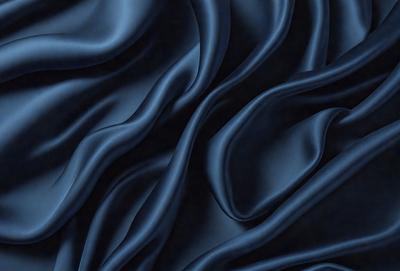 The primary subject of the image is a blue fabric, which appears to be a piece of cloth or a curtain. The setting is a dark room, and the visual style is a close-up of the blue fabric. The colors and mood of the image are predominantly dark and moody, with the blue fabric being the main focus.