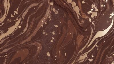 The primary subject of the image is a close-up of a brown, textured surface, possibly a piece of wood or a wall. The setting appears to be a room with a brown and gold color scheme. The visual style of the image is a close-up, which emphasizes the textured surface and the intricate patterns on the brown material. The colors and mood of the image are warm and earthy, creating a cozy and inviting atmosphere.