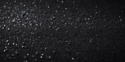 The primary subject of the image is a black background with a pattern of white stars. The setting is a dark, starry night, and the visual style is a close-up of the black background with the white stars. The colors and mood of the image are predominantly dark and mysterious, with the white stars providing a touch of brightness and contrast.