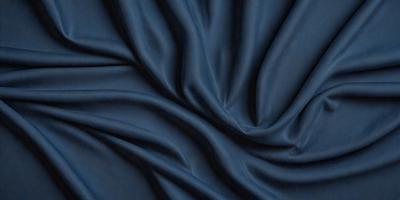 The primary subject of the image is a blue fabric, which appears to be a piece of cloth or a curtain. The setting is a dark background, which contrasts with the blue fabric. The visual style is a close-up of the fabric, showcasing its texture and details. The colors and mood of the image are predominantly dark and moody, with the blue fabric being the main focal point.