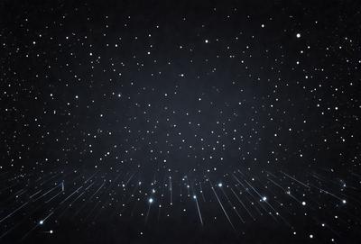 The primary subject of the image is a night sky filled with stars. The setting is a dark, star-filled sky, and the visual style is a photo. The colors and mood of the image are predominantly dark and serene, with the stars providing a sense of depth and beauty.