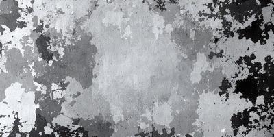 The primary subject of the image is a large, white, and gray square. The setting is a concrete surface, and the visual style appears to be a combination of a photo and digital art. The colors and mood of the image are predominantly gray and white, giving it a somewhat dull and monotonous appearance.