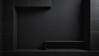 The primary subject of the image is a black wall with a black step. The setting is a dark room, and the visual style is a black and white photo. The dominant colors and overall atmosphere are dark and moody.
