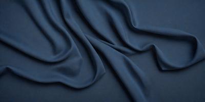 The primary subject of the image is a blue fabric, which is the main object, scene, or focus of the image. The setting or background is a dark blue surface, and the visual style appears to be a photo. The dominant colors and overall atmosphere are dark and moody, with the blue fabric being the main source of color.