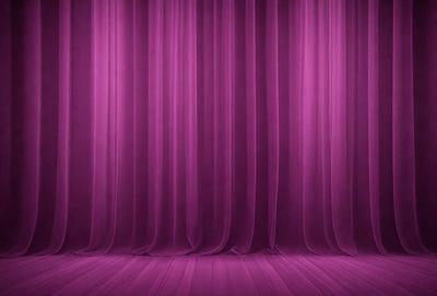 The primary subject of the image is a purple curtain, which is the main object, scene, or focus of the image. The setting is a stage or theater, with the curtains covering the background. The visual style is a photo, and the dominant colors are purple and pink, creating a warm and inviting atmosphere.