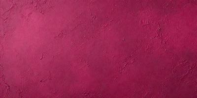 The primary subject of the image is a red wall with a pinkish hue. The setting is a room with a red wall, and the visual style is a close-up of the wall. The dominant colors are red and pink, creating a warm and inviting atmosphere.