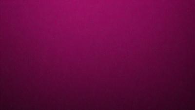 The primary subject of the image is a close-up of a purple surface, which appears to be a piece of fabric or a wall. The setting is a room with a purple background, and the visual style is a close-up of the purple surface. The colors and mood of the image are predominantly purple, creating a calm and soothing atmosphere.