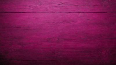 The primary subject of the image is a wooden surface with a pinkish hue. The setting is a room with a wooden floor, and the visual style appears to be a photo. The dominant colors in the image are pink and brown, creating a warm and inviting atmosphere.