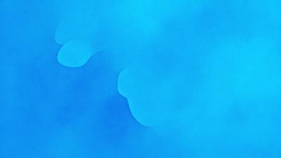 The primary subject of the image is a blue sky with a few clouds. The setting is a cloudy blue sky, and the visual style is a natural, outdoor atmosphere. The colors and mood are predominantly blue, creating a calm and serene environment.