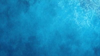The primary subject of the image is a large body of water, which appears to be a deep blue ocean. The setting is a vast expanse of water, with no visible land or other objects. The visual style of the image is a close-up of the water, showcasing its depth and beauty. The colors and mood of the image are predominantly blue, creating a serene and calming atmosphere.