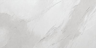 The primary subject of the image is a white wall with a textured surface. The setting is a room with a white background. The visual style is a close-up of the wall, showcasing its texture and appearance. The colors and mood of the image are predominantly white, giving it a clean and minimalist appearance.