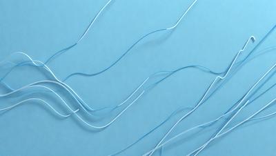 The primary subject of the image is a close-up of a blue surface with white strings or wires. The setting appears to be a blue background, and the visual style is a close-up of the strings. The colors in the image are predominantly blue and white, creating a calm and serene atmosphere.