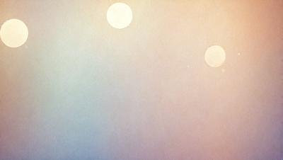 The primary subject of the image is a pair of white circles, which are the main objects in the scene. The setting is a cloudy sky, with the circles floating in the background. The visual style is a combination of a photo and a drawing, creating a unique and artistic representation of the scene. The colors and mood of the image are predominantly white and gray, giving it a calm and serene atmosphere.