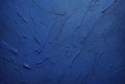 The primary subject of the image is a blue wall with a textured surface. The setting is a room with a blue background. The visual style is a close-up of the blue wall, which gives a sense of depth and texture. The dominant colors are blue and grey, creating a calm and soothing atmosphere.