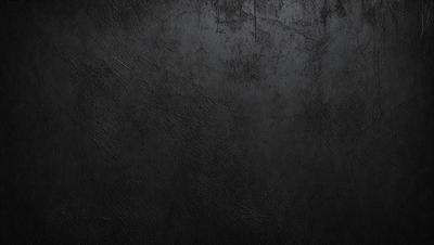 The primary subject of the image is a black leather surface. The setting is a dark room, and the visual style is a close-up of the leather surface. The colors and mood of the image are predominantly dark and moody, with the black leather serving as the focal point.