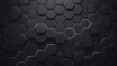 The primary subject of the image is a black and white patterned surface, which appears to be a wall or a piece of artwork. The setting is a dark room, and the visual style is a close-up of the patterned surface. The colors and mood of the image are predominantly dark and moody, with the black and white pattern creating a sense of depth and intrigue.