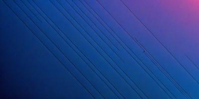The primary subject of the image is a wire, which is the main object, scene, or focus of the image. The setting/background consists of a blue sky, and the visual style is a photo. The colors and mood of the image are predominantly blue, creating a calm and serene atmosphere.