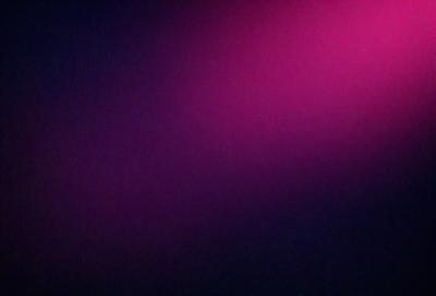 The primary subject of the image is a purple wall. The setting is a dark room, and the visual style appears to be a photo. The dominant colors are purple and black, creating a moody atmosphere.