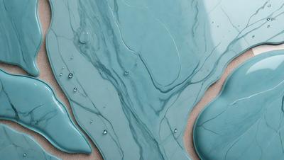 The primary subject of the image is a blue marble-like surface with a pattern of dripping water. The setting is a sandy surface, and the visual style appears to be a digital art or illustration. The dominant colors are blue and white, creating a cool and calming atmosphere.