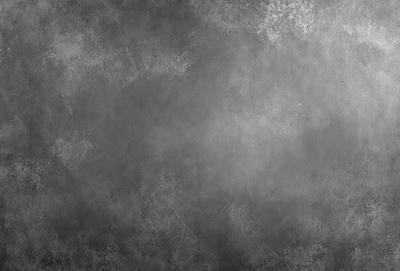 The primary subject of the image is a gray, textured wall. The setting is a concrete wall, and the visual style is a photo. The dominant colors are gray, and the overall atmosphere is somewhat dark and moody.