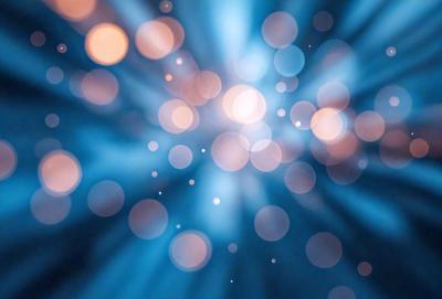 The primary subject of the image is a bright blue background with a multitude of white lights or sparkles. The setting appears to be a dark space, possibly a night sky, as the lights stand out against the dark background. The visual style of the image is a combination of a photo and digital art, creating a unique and captivating effect. The colors and mood of the image are predominantly blue and white, with a sense of energy and movement due to the sparkling lights.