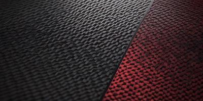The primary subject of the image is a black and red carpet. The setting is a room with a black and red carpet on the floor. The visual style is a photo, and the dominant colors are black and red. The overall atmosphere is bold and striking, with the red carpet standing out against the black background.