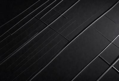 The primary subject of the image is a close-up of a black and white pattern, which appears to be a black and white tire. The setting is a dark background, and the visual style is a black and white photo. The dominant colors are black and white, and the overall atmosphere is moody and dramatic.