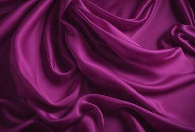 The primary subject of the image is a purple fabric, which is the main object, scene, or focus of the image. The setting or background consists of a purple cloth, and the visual style is a close-up of the purple fabric. The colors and mood of the image are predominantly purple, creating a calm and serene atmosphere.