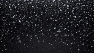 Primary subject: Snowflakes
Setting/background: Black sky
Visual style: Photo
Colors and mood: White snowflakes against a dark sky, creating a serene and peaceful atmosphere.