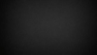 The primary subject of the image is a black background. The setting is a dark, empty space with no visible objects or elements. The visual style is a simple, monochromatic design. The colors and mood are predominantly dark and moody, creating a sense of mystery or drama.