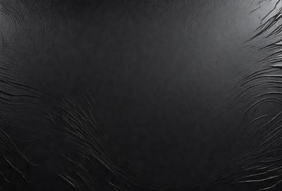 The primary subject of the image is a black leather surface. The setting is a dark room, and the visual style appears to be a photo. The colors and mood of the image are predominantly dark and moody, with the black leather surface being the main focus.