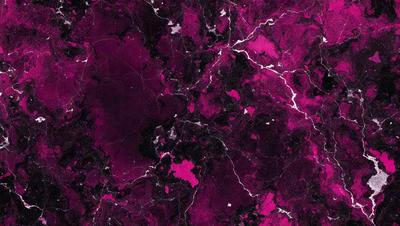 The primary subject of the image is a close-up of a marbled surface, which appears to be a purple marble. The setting is a dark room, and the visual style is a close-up of the marbled surface. The colors and mood of the image are predominantly purple, creating a moody and dramatic atmosphere.