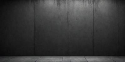 The primary subject of the image is a large, gray concrete wall. The setting is a room with a concrete floor, and the visual style is a photo. The dominant colors are gray and black, creating a moody atmosphere.