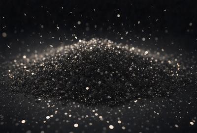 The primary subject of the image is a close-up of a black powdery substance, possibly a fine grain of sand or a speckled material. The setting is a dark background, which contrasts with the black substance. The visual style appears to be a close-up of a pattern or texture, possibly a digital art or illustration. The colors and mood of the image are predominantly dark, with the black substance being the main focus.