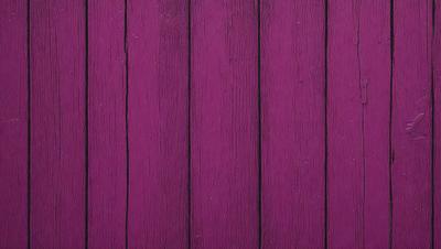 The primary subject of the image is a purple wooden wall. The setting is a room with a purple wooden wall, which serves as the background. The visual style is a close-up of the purple wooden wall, showcasing its texture and color. The dominant colors are purple and brown, creating a warm and inviting atmosphere.