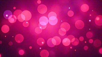 The primary subject of the image is a pink background with a pattern of pink and white dots. The setting is a dark background, which contrasts with the bright pink dots. The visual style is a digital art or illustration, as the dots are arranged in a visually appealing manner. The colors and mood of the image are predominantly pink, creating a warm and inviting atmosphere.