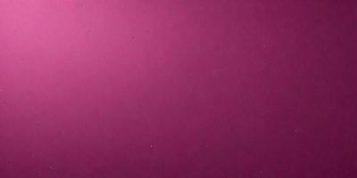 The primary subject of the image is a large, pink wall. The setting is a room with a pink background. The visual style is a close-up of the pink wall, which appears to be a patterned wallpaper. The colors and mood of the image are predominantly pink, creating a warm and inviting atmosphere.