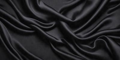 The primary subject of the image is a black fabric, which appears to be a piece of clothing or a curtain. The setting is a dark room, and the visual style is a close-up of the fabric. The colors and mood of the image are predominantly dark and moody, with the black fabric being the main focus.