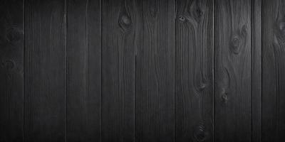 The primary subject of the image is a wooden surface, possibly a table or a wall, with a black color. The setting is a room with a black background, and the visual style appears to be a photo. The colors and mood of the image are dark and moody, creating a sense of depth and contrast.