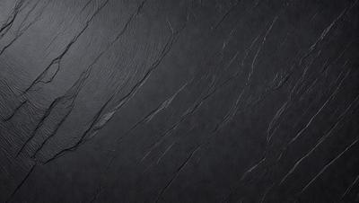 The primary subject of the image is a black leather surface, which appears to be a leather wall or a leather-like material. The setting is a dark room, and the visual style is a close-up of the leather surface. The colors and mood of the image are predominantly dark and moody, with the black leather surface being the main focus.