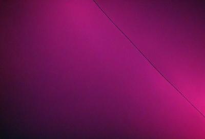 The primary subject of the image is a purple wall with a wire running across it. The setting is a room with a purple background, and the visual style appears to be a photo. The dominant colors in the image are purple and pink, creating a warm and inviting atmosphere.