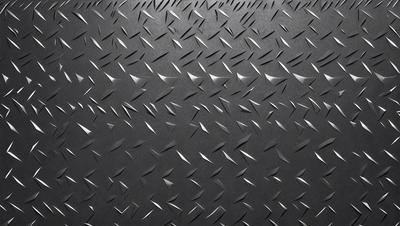 The primary subject of the image is a close-up of a black surface with a pattern of silver spikes. The setting appears to be a black background, and the visual style is a patterned texture. The dominant colors are black and silver, creating a bold and striking appearance.