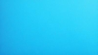 The primary subject of the image is a large, empty blue sky. The setting is a vast, open space with no visible landmarks or objects. The visual style is a simple, clean blue background, which creates a calm and serene atmosphere.