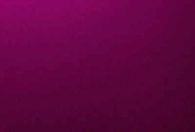 The primary subject of the image is a large, purple wall. The setting is a room with a purple background, and the visual style is a close-up of the wall. The dominant colors in the image are purple, and the overall atmosphere is calm and serene.