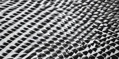 The primary subject of the image is a patterned surface, which appears to be a black and white checkered pattern. The setting is a white background, and the visual style is a close-up of the pattern. The dominant colors are black and white, and the overall atmosphere is geometric and artistic.