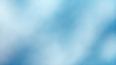 The primary subject of the image is a blue sky with clouds. The setting is a cloudy day, and the visual style is a photo. The dominant colors are blue and white, creating a calm and serene atmosphere.